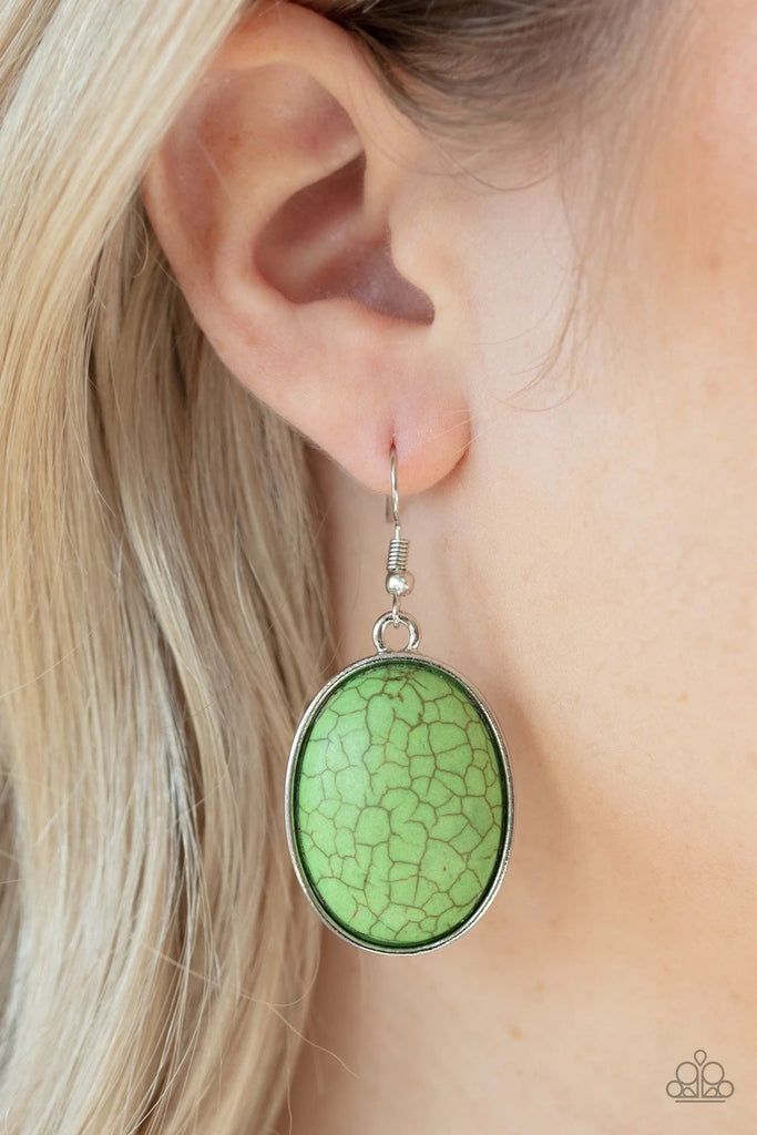 Chiseled into a serene oval, a refreshing green stone is pressed into a sleek silver frame for a seasonal flair. Earring attaches to a standard fishhook fitting.  Sold as one pair of earrings.