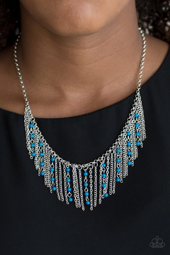 Infused with blue beaded tassels, shimmery silver chains stream below the collar, creating a colorful fringe. Features an adjustable clasp closure.  Sold as one individual necklace. Includes one pair of matching earrings.  