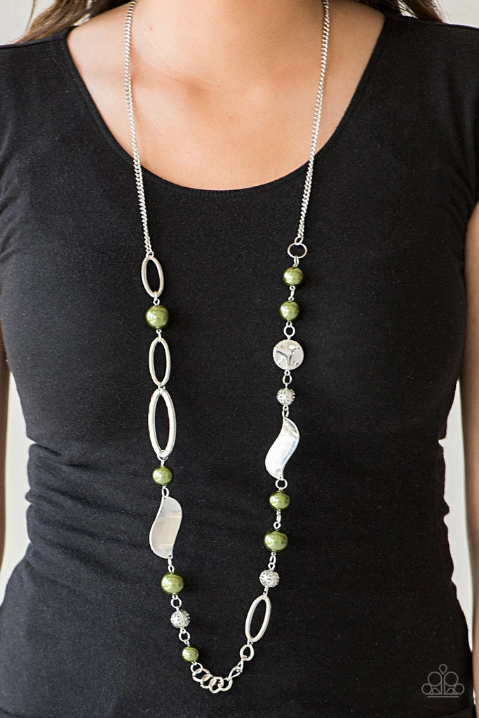 Over sized green pearls, ornate silver beads, and an array of glistening silver accents trickle along a lengthened silver chain for a refined look. Features an adjustable clasp closure.  Sold as one individual necklace. Includes one pair of matching earrings.