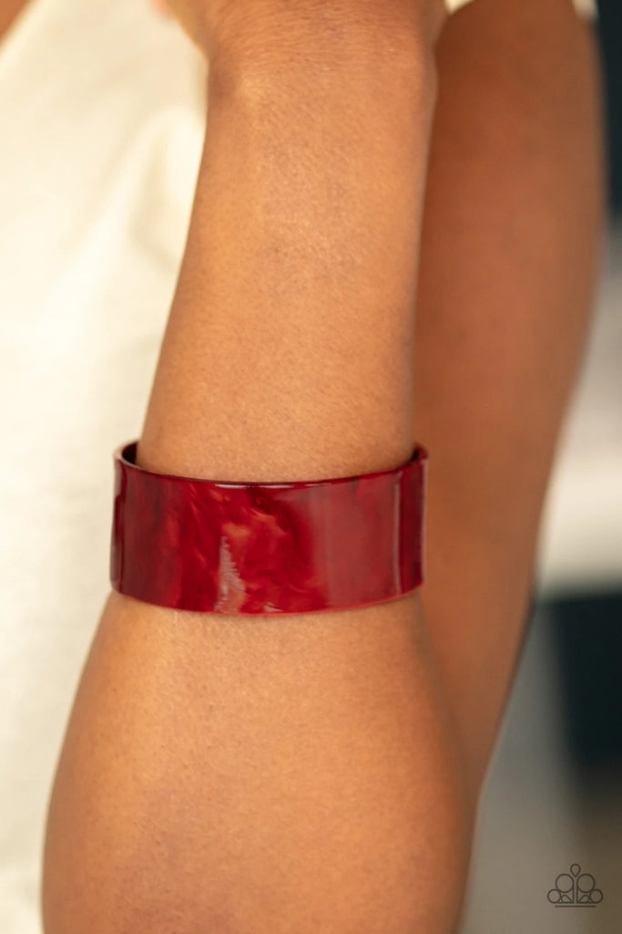 Glazed in shimmer, a red acrylic cuff curls across the wrist for a colorfully retro look.  Sold as one individual bracelet.