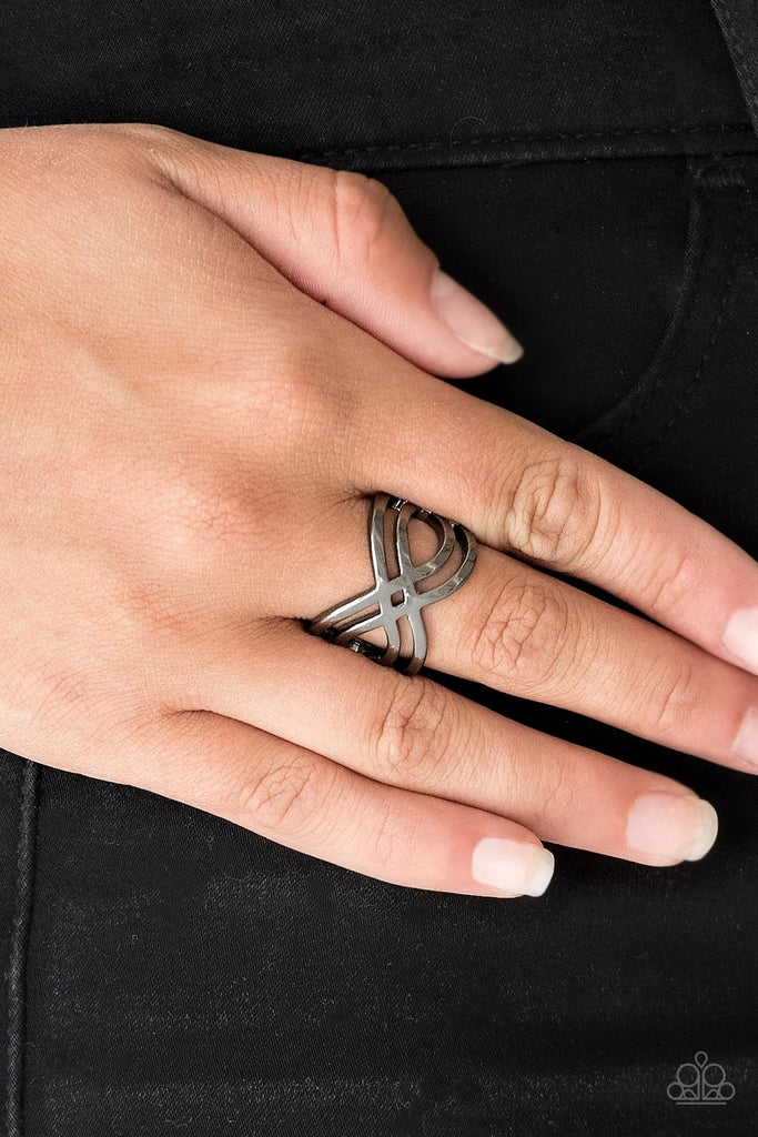Brushed in a high-sheen finish, glistening gunmetal bars ripple across the finger, coalescing into a whimsical infinity frame. Features a stretchy band for a flexible fit.  Sold as one individual ring.