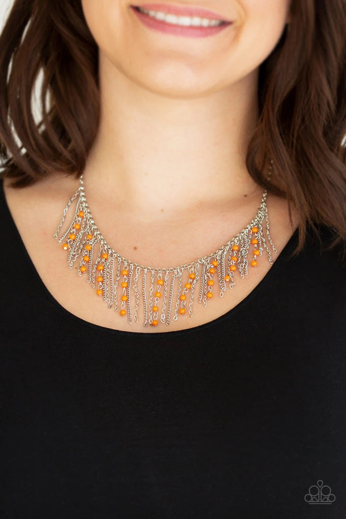 Infused with vibrant orange beaded tassels, shimmery silver chains stream below the collar, creating a colorful fringe. Features an adjustable clasp closure.  Sold as one individual necklace. Includes one pair of matching earrings.