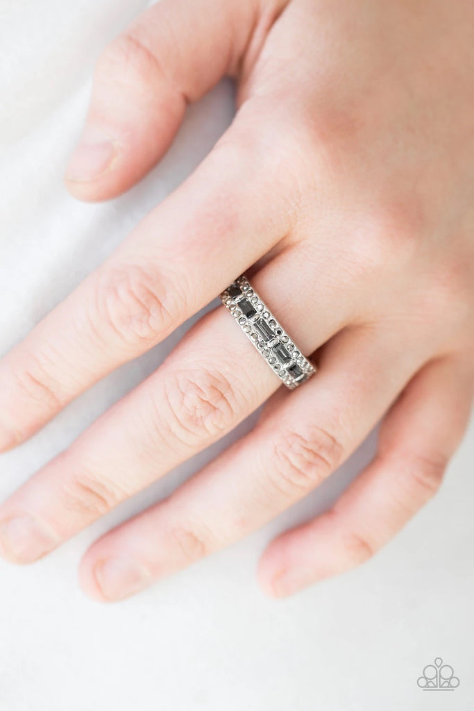 Featuring classic round and regal emerald style cuts, smoky and glassy hematite rhinestones are encrusted along a dainty silver band for a refined look. Features a dainty stretchy band for a flexible fit.  Sold as one individual ring.  