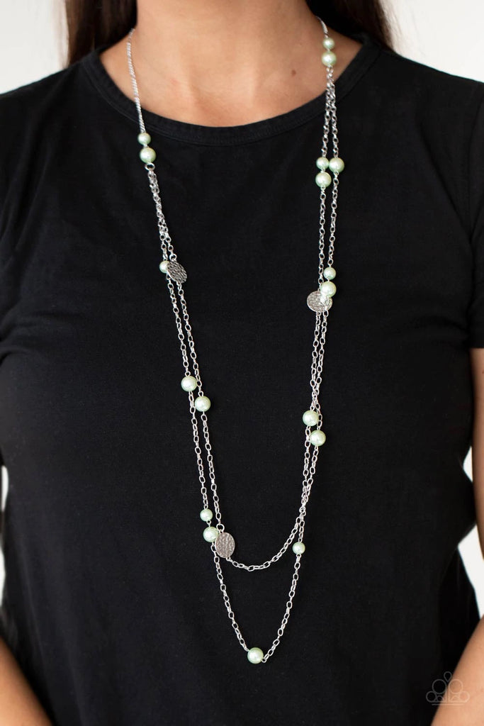 Double strands of lengthened silver chains are adorned with soft Green Ash pearls. Three shiny hammered silver discs create bold asymmetrical accents for an eye-catching finish. Features an adjustable clasp closure.  Sold as one individual necklace. Includes one pair of matching earrings.  