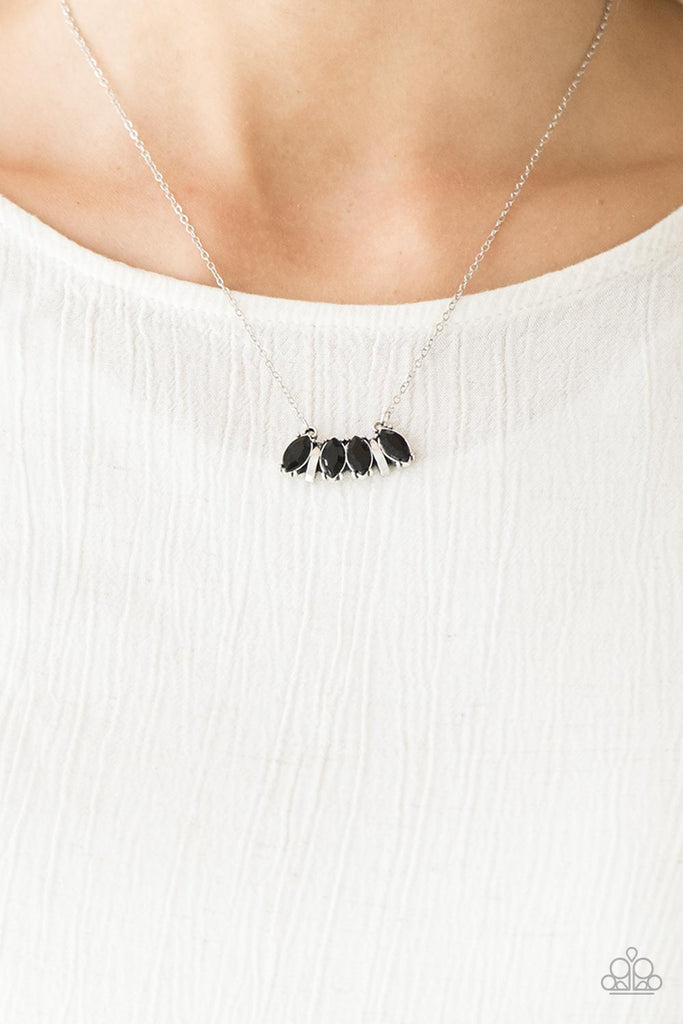 Featuring elegant marquise style cuts, glittery black rhinestones join with silver accents below the collar, creating a dainty pendant. Features an adjustable clasp closure.  Sold as one individual necklace. Includes one pair of matching earrings.