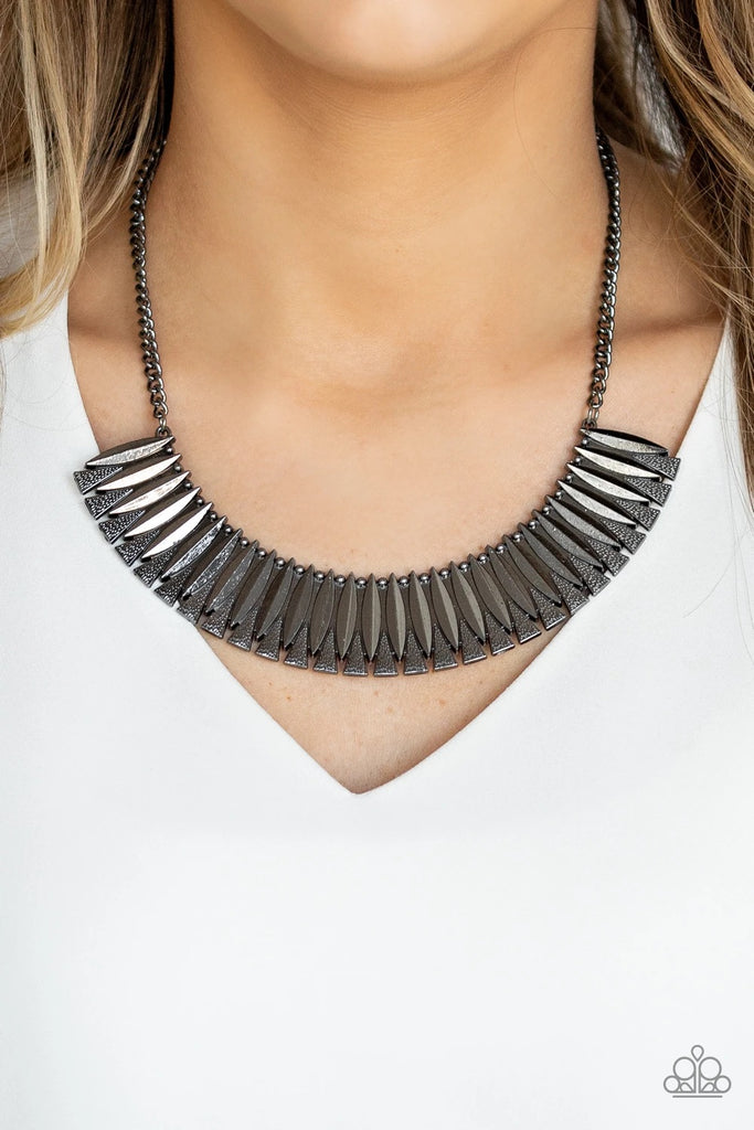 Infused with dainty gunmetal studs, sleek geometric gunmetal plates connect with hammered gunmetal triangles, creating a fierce half-moon plate below the collar. Features an adjustable clasp closure.  Sold as one individual necklace. Includes one pair of matching earrings.