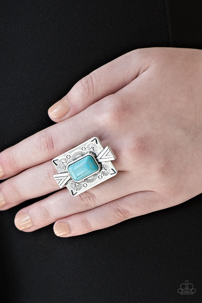 Chiseled into a tranquil rectangle, a refreshing turquoise stone is pressed into a bold silver frame radiating with tribal inspired patterns for a seasonal look. Features a stretchy band for a flexible fit.  Sold as one individual ring.
