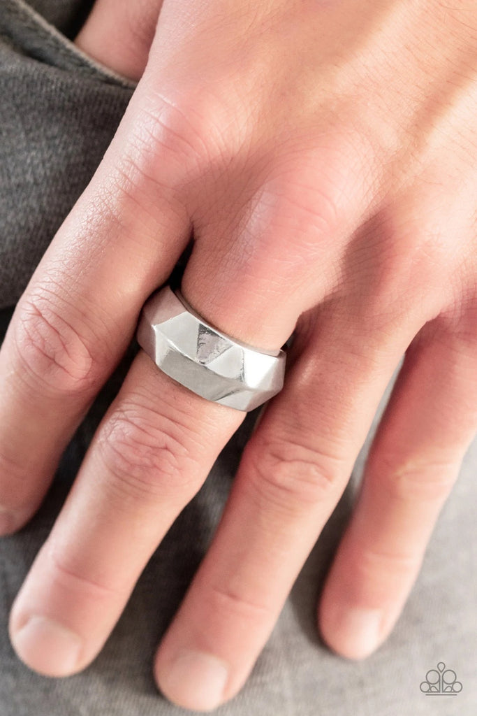 Featuring an edgy geometric faceted surface, a thick silver band arcs across the finger. Features a stretchy band for a flexible fit.  Sold as one individual ring.