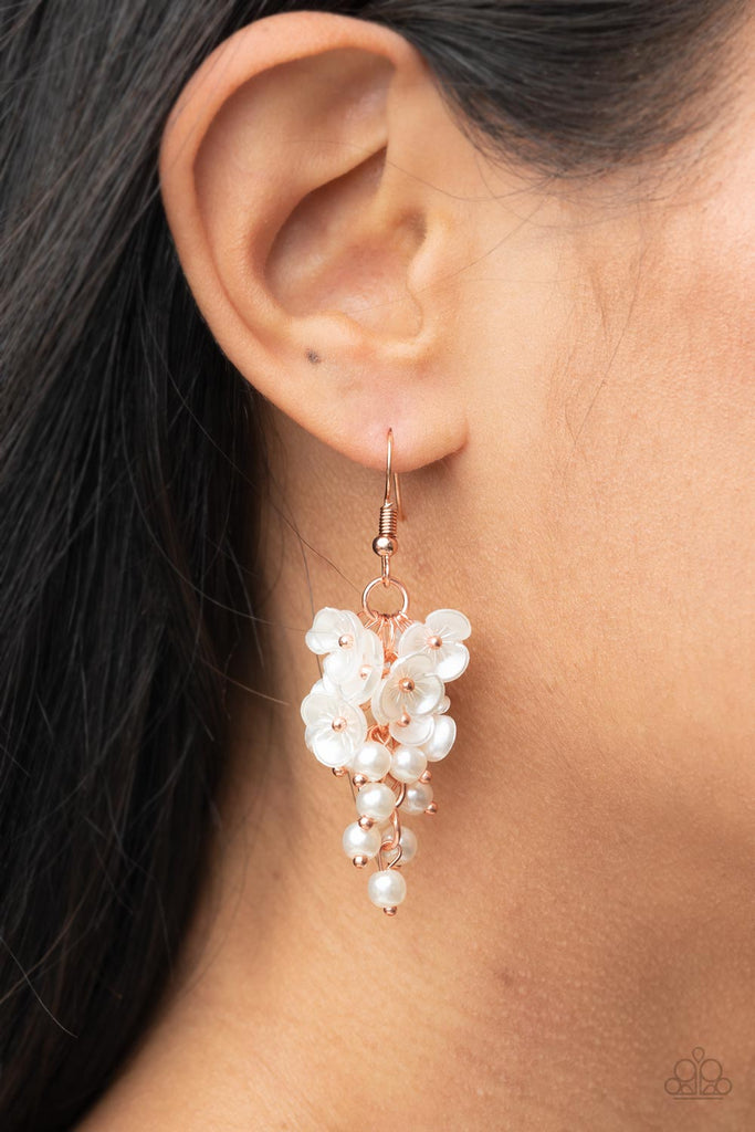 A cluster of pearly white floral frames and dainty white pearls trickle from a copper chain, creating a romantic chandelier. Earring attaches to a standard fishhook fitting.  Sold as one pair of earrings.
