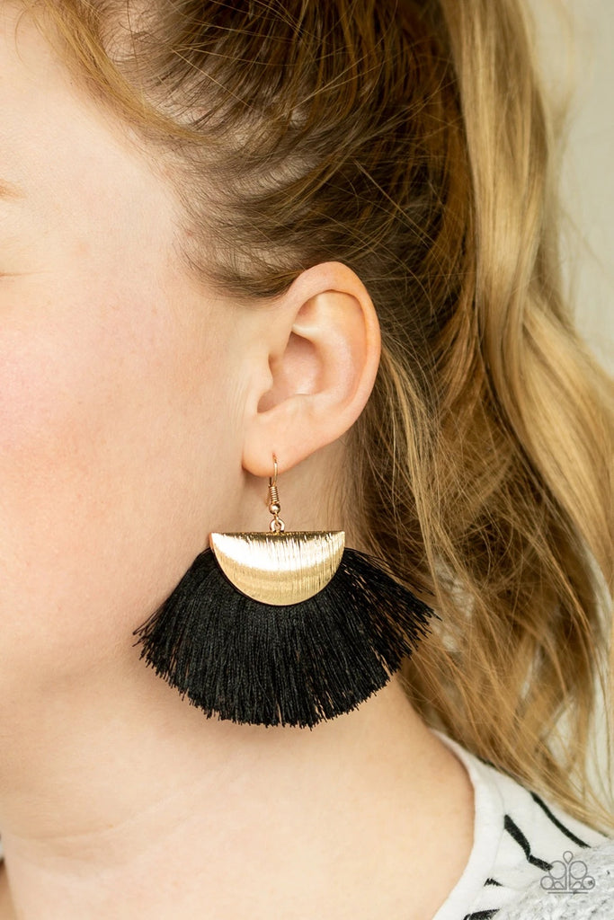 A fan of shiny black thread flares out from the bottom of a shimmery gold crescent frame, creating a foxy fringe. Earring attaches to a standard fishhook fitting.  Sold as one pair of earrings.