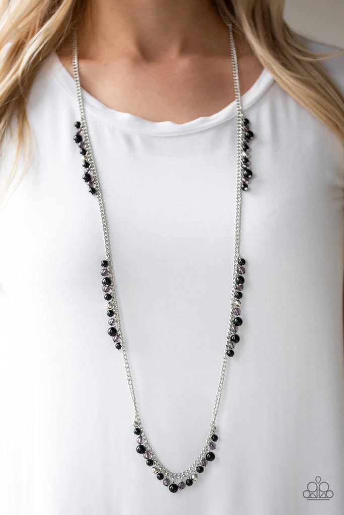 Sections of shiny silver, polished black, and glassy beads trickle along a shimmery silver chain along the chest for a flirtatious look. Features an adjustable clasp closure.  Sold as one individual necklace. Includes one pair of matching earrings.  