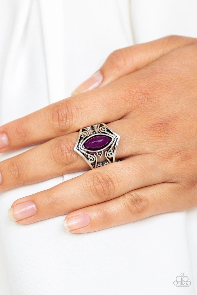 Featuring a marquise shape, a shiny purple bead is pressed into a shimmery silver band radiating with vine-like filigree for a whimsical look. Features a stretchy band for a flexible fit.  Sold as one individual ring.