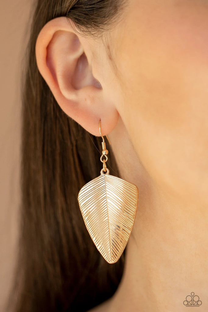 Stamped in lifelike details, a dainty gold feather delicately swings from the ear for a rustically refined look. Earring attaches to a standard fishhook fitting.  Sold as one pair of earrings.
