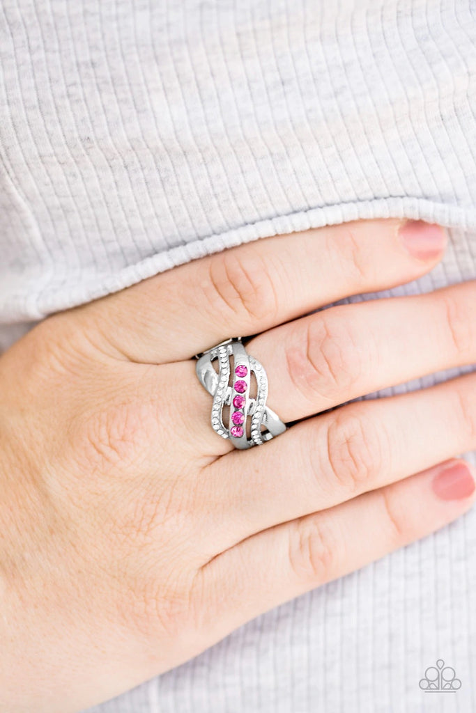 Shimmery silver bars swoop across the finger, creating an airy band. Complemented with dainty white rhinestones, the center most silver band is encrusted in glittery pink rhinestones for a flirtatious finish.  Sold as one individual ring.