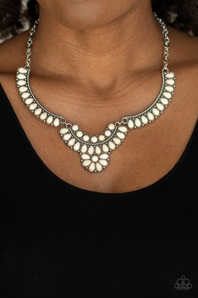 Featuring round and teardrop shapes, a collection of tranquil white stone beads are pressed into interconnected silver plates, creating a refreshing floral inspired statement piece below the collar. Features an adjustable clasp closure.  Sold as one individual necklace. Includes one pair of matching earrings.