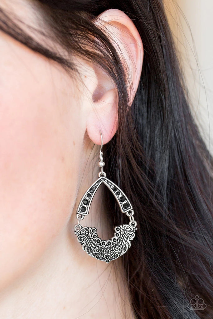 Encrusted in dazzling black rhinestones, an arcing silver frame links with an ornate silver frame radiating with filigree filled details for a refined look. Earring attaches to a standard fishhook fitting.  Sold as one pair of earrings.