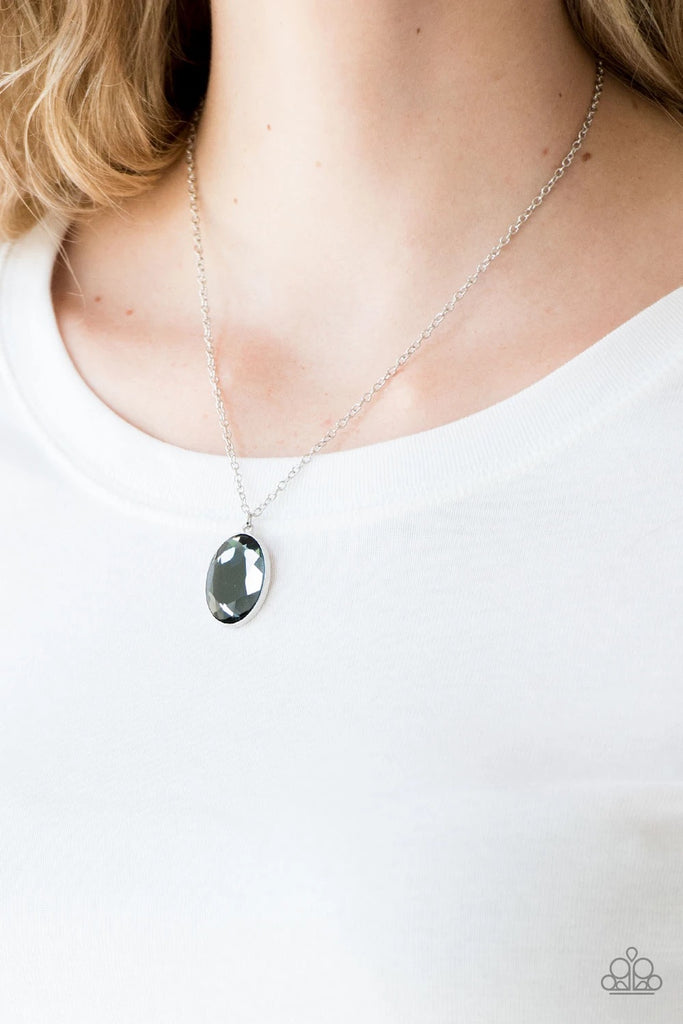 Pressed into a sleek silver frame, a faceted smoky gem swings below the collar for a glamorous look. Features an adjustable clasp closure.  Sold as one individual necklace. Includes one pair of matching earrings.