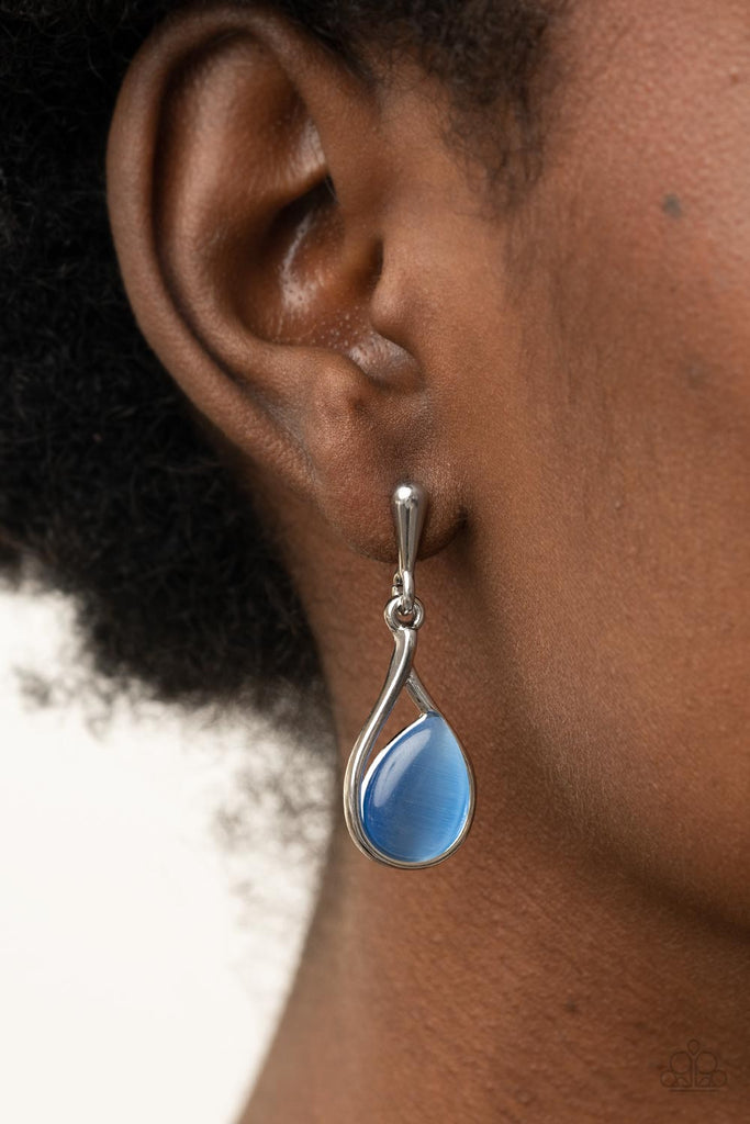A glowing blue cat's eye stone sits askance in a simple silver teardrop frame as it dangles from a solid silver bulb creating a polished finish. Earring attaches to a standard post fitting.  Sold as one pair of post earrings.
