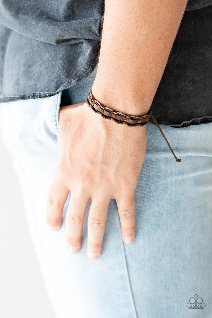 Mismatched brown cording knots around a brown leather band for a rugged look. Features an adjustable sliding knot closure.  Sold as one individual bracelet.