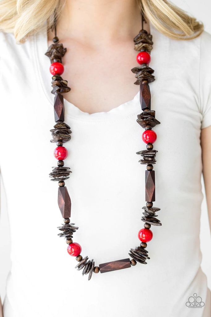 Featuring round, faceted, and distressed finishes, mismatched brown wooden beads are threaded along shiny brown cording. Fiery red wooden beads trickle between the earthy accents, adding a colorful finish to the summery palette. Features an adjustable sliding knot closure.  Sold as one individual necklace. Includes one pair of matching earrings.