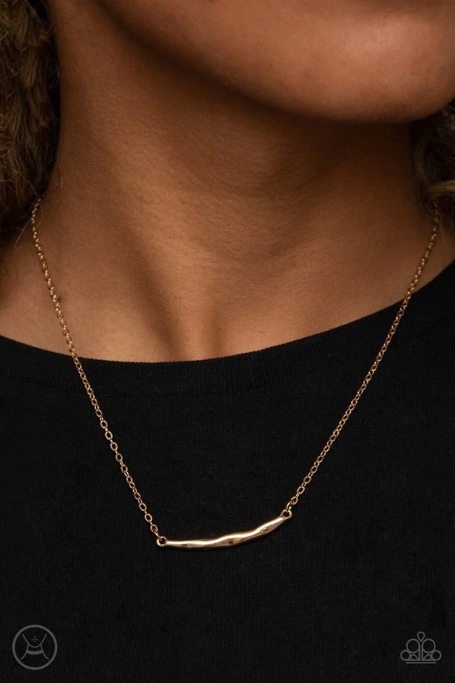 A hammered gold crescent attaches to a dainty gold chain around the neck for a trendy minimalist inspired look. Features an adjustable clasp closure.  Sold as one individual necklace. Includes one pair of matching earrings.