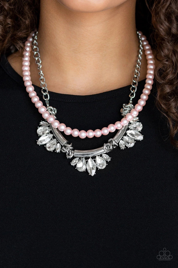 A classic strand of pink pearls and dramatic silvery chain drape below the collar. Infused with heavy metal accents, teardrop and marquise cut white rhinestone frames connect into a show-stopping fringe. Features an adjustable clasp closure.  Sold as one individual necklace. Includes one pair of matching earrings.