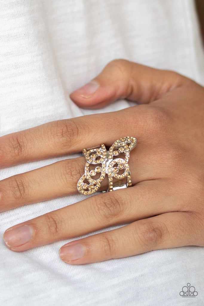 Encrusted in golden topaz rhinestones, two rows of dizzying silver frames overlap across the finger, creating a refined stacked look. Features a stretchy band for a flexible fit.  Sold as one individual ring.