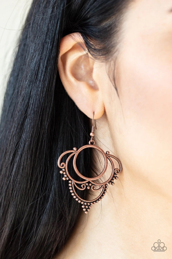 Dotted in dainty copper studs, antiqued copper frames swirl into an ornate design for a vintage inspired look. Earring attaches to a standard fishhook fitting.  Sold as one pair of earrings.