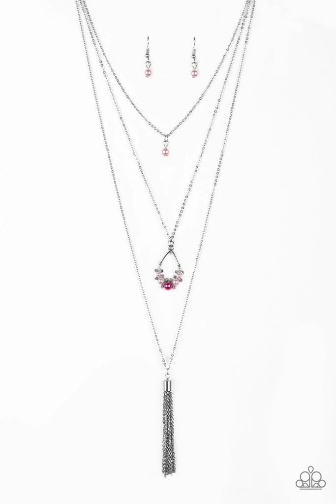 A solitaire pink pearl swings from the uppermost chain, giving way to a teardrop pendant and shimmery silver chain tassel. Dainty white rhinestones and pink pearls collect at the bottom of the centermost pendant for a glamorous finish. Features an adjustable clasp closure.  Sold as one individual necklace. Includes one pair of matching earrings.