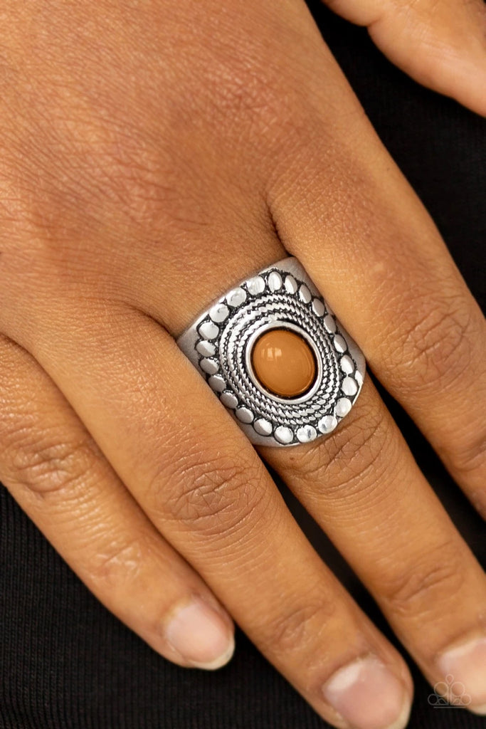 A shiny Meerkat bead is pressed into the center of a thick band radiating with dotted and rope-like patterns for a seasonal look. Features a stretchy band for a flexible fit.  Sold as one individual ring.