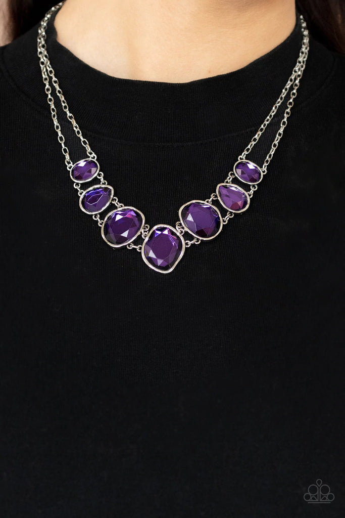 Encased in hammered asymmetrical silver frames, an imperfect collection of faceted purple gems are suspended from two shimmery silver chains as they double-link below the collar for a dramatic effect. Features an adjustable clasp closure.  Sold as one individual necklace. Includes one pair of matching earrings.