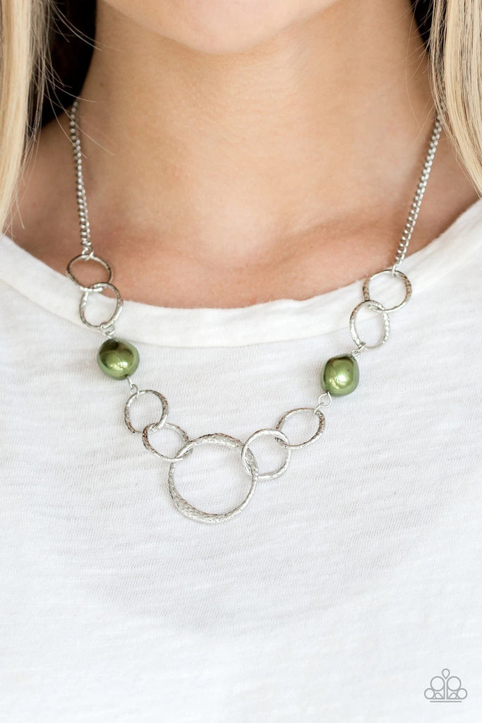 Pearly green pebbles join with delicately hammered silver rings below the collar for a refined flair. Features an adjustable clasp closure.  Sold as one individual necklace. Includes one pair of matching earrings.  