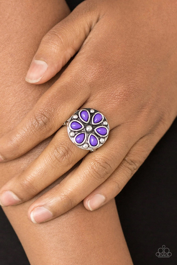 Vivacious purple beads are pressed into a studded silver frame, creating a colorful floral centerpiece atop the finger. Features a stretchy band for a flexible fit.  Sold as one individual ring.