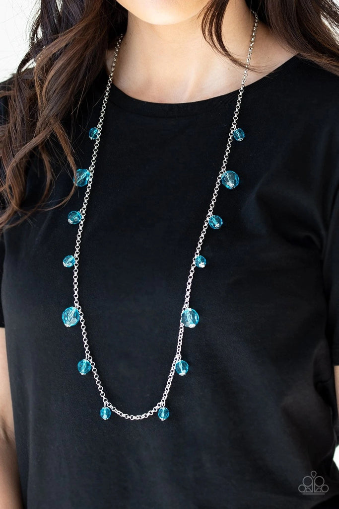 Varying in size, a collection of glassy blue crystal-like beads trickle down a shimmery silver chain across the chest for a whimsical look. Features an adjustable clasp closure.  Sold as one individual necklace. Includes one pair of matching earrings.