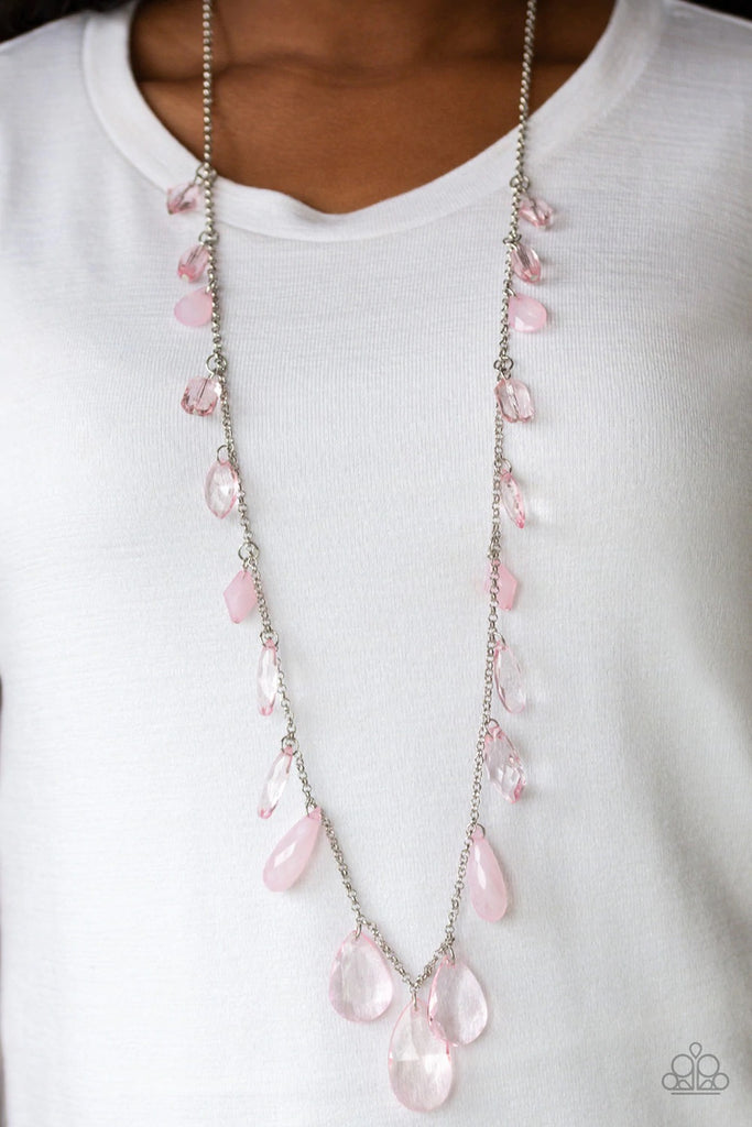 A gorgeous collection of glassy and cloudy pink crystal-like beads trickle along a shimmery silver chain down the chest in a whimsical fashion. Features an adjustable clasp closure.  Sold as one individual necklace. Includes one pair of matching earrings.