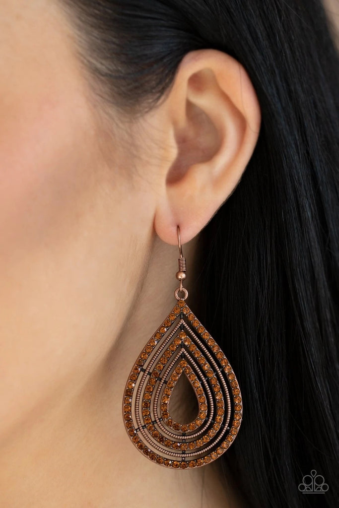 Topaz rhinestone encrusted frames and textured copper frames alternate into a dramatic teardrop for a refined flair. Earring attaches to a standard fishhook fitting.  Sold as one pair of earrings.