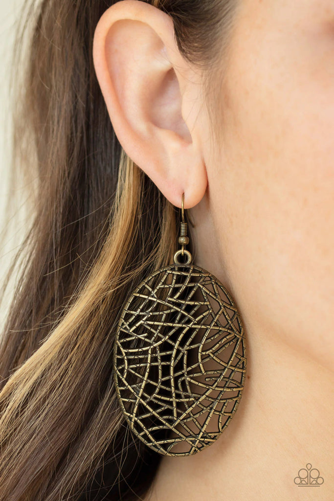 Brushed in an antiqued finish, textured brass bars crisscross across the front of an oval frame, creating a shattered pattern. Earring attaches to a standard fishhook fitting.  Sold as one pair of earrings.  