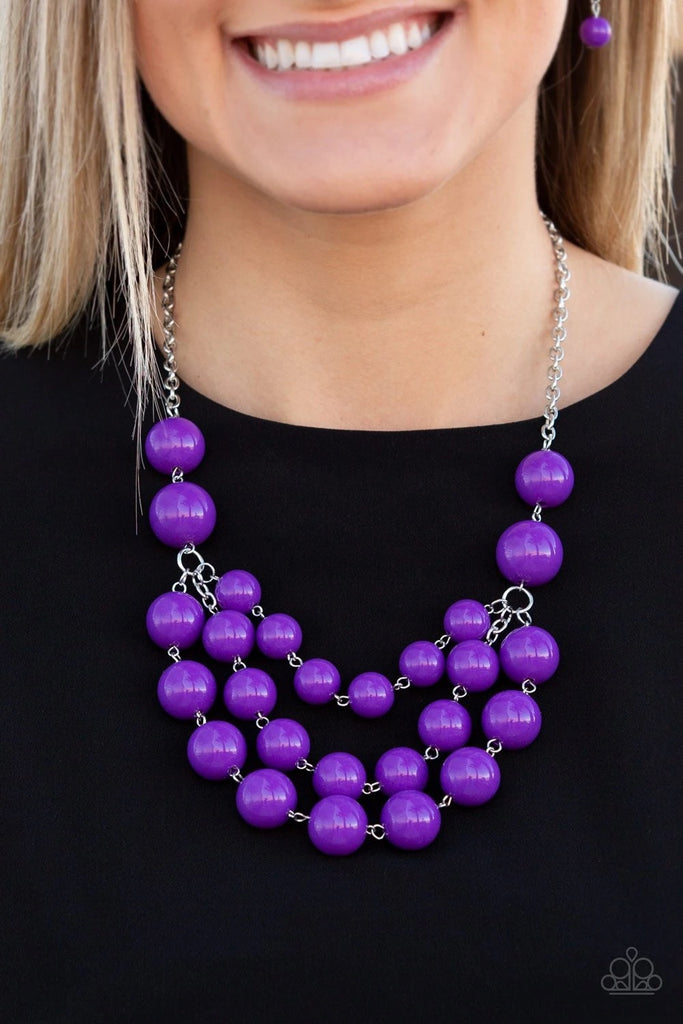 Three strands of bubbly purple beads cascade below the collar, creating colorful layers. Features an adjustable clasp closure.  Sold as one individual necklace. Includes one pair of matching earrings.