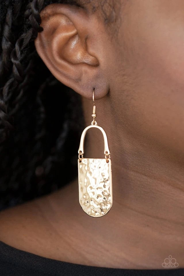 A hammered gold piece links to the bottom of a bowing gold bar, creating an abstract lure. Earring attaches to a standard fishhook fitting.  Sold as one pair of earrings.