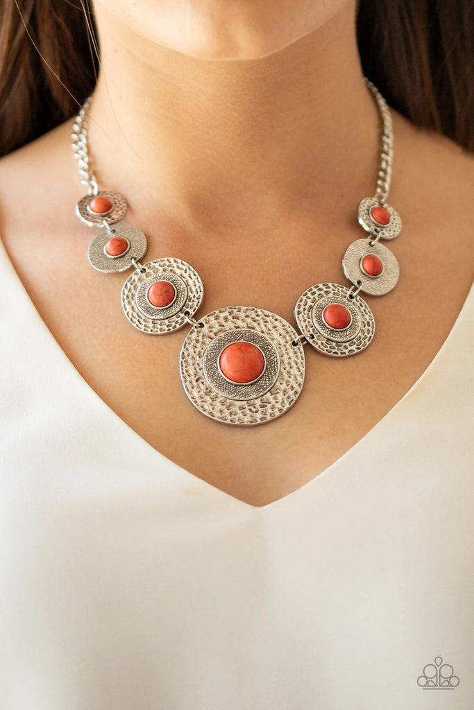 Dotted with refreshing orange stone centers, mismatched hammered silver frames gradually increase in size as they link below the collar for a fierce look. Features an adjustable clasp closure.  Sold as one individual necklace. Includes one pair of matching earrings.