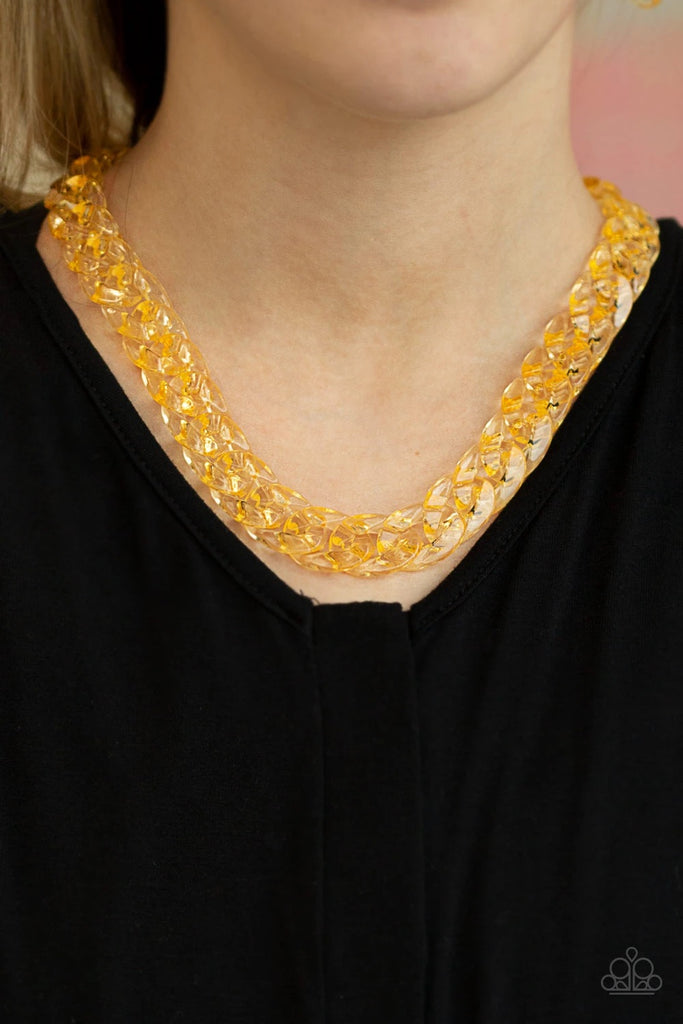 Glassy gold links connect below the collar for a bold statement-making look. Features an adjustable clasp closure.  Sold as one individual necklace. Includes one pair of matching earrings.