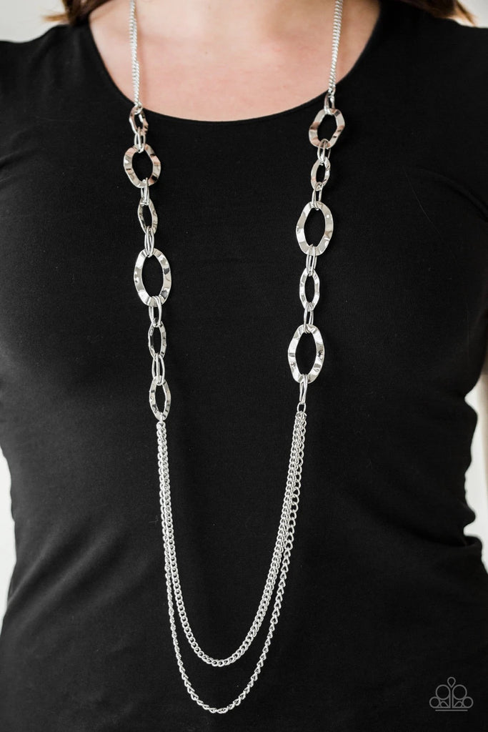 Hammered silver rings give way to rows of mismatched silver chains, creating edgy layers down the chest. Features an adjustable clasp closure.  Sold as one individual necklace. Includes one pair of matching earrings.