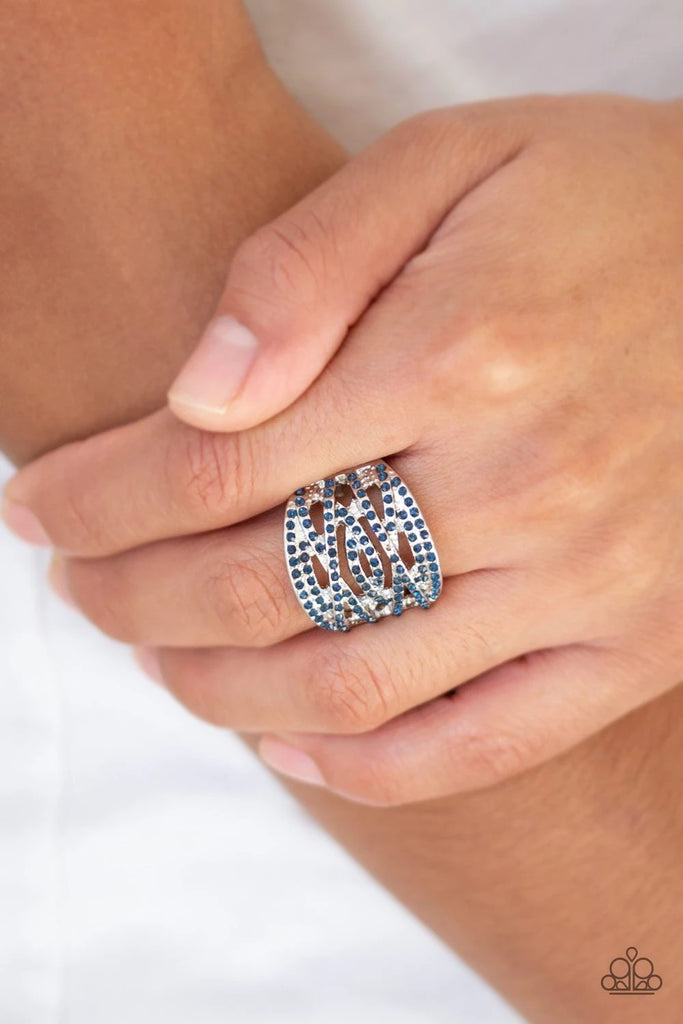 Radiating with dainty blue rhinestones, glittery silver bands crisscross across the finger for a refined look. Features a stretchy band for a flexible fit.  Sold as one individual ring.