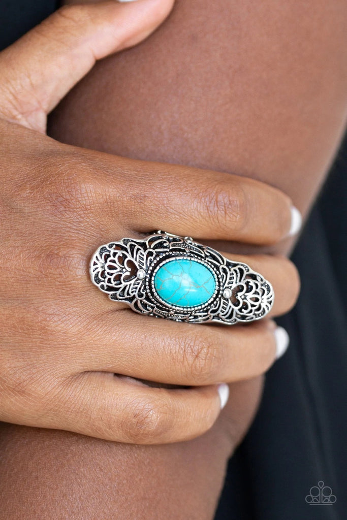 Dotted with a refreshing turquoise stone center, glistening silver filigree climbs the finger, coalescing into a dramatic frame. Features a stretchy band for a flexible fit.  Sold as one individual ring.