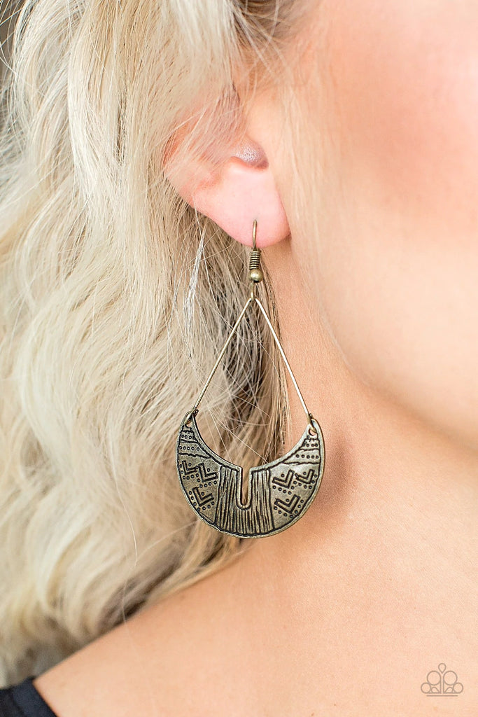 Stamped in tribal inspired patterns, a brass crescent frame attaches to triangular bar fittings for an indigenous look. Earring attaches to a standard fishhook fitting.  Sold as one pair of earrings.