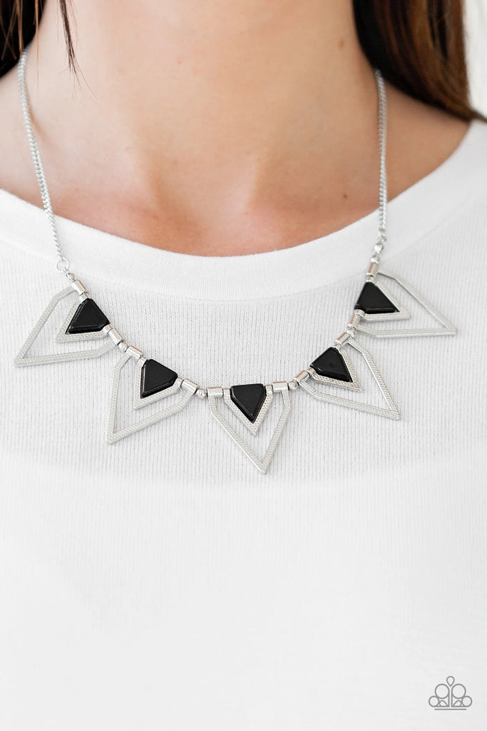Infused with shiny black beading, glistening silver triangular frames join below the collar, creating a fierce geometric fringe. Features an adjustable clasp closure.  Sold as one individual necklace. Includes one pair of matching earrings.