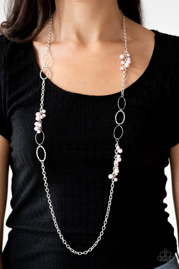Smooth and hammered silver rings join clusters of shiny pink beads along a shimmery silver chain for a colorful look. Features an adjustable clasp closure.  Sold as one individual necklace. Includes one pair of matching earrings.
