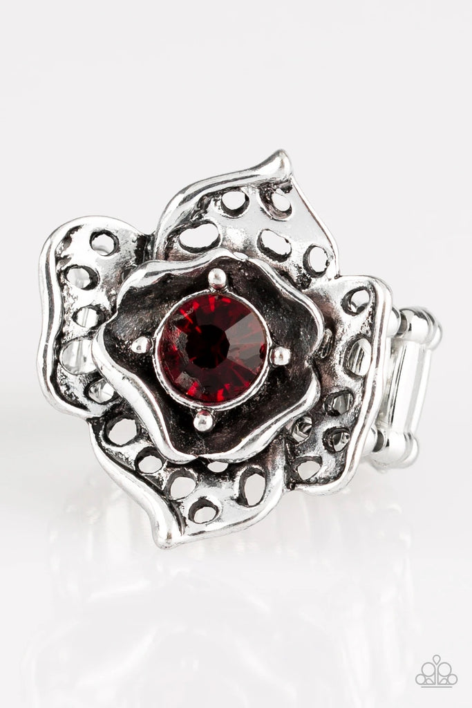 Featuring airy cut-out textures, antiqued silver petals gather around a glowing red rhinestone center for a whimsical look. Features a stretchy band for a flexible fit.  Sold as one individual ring.