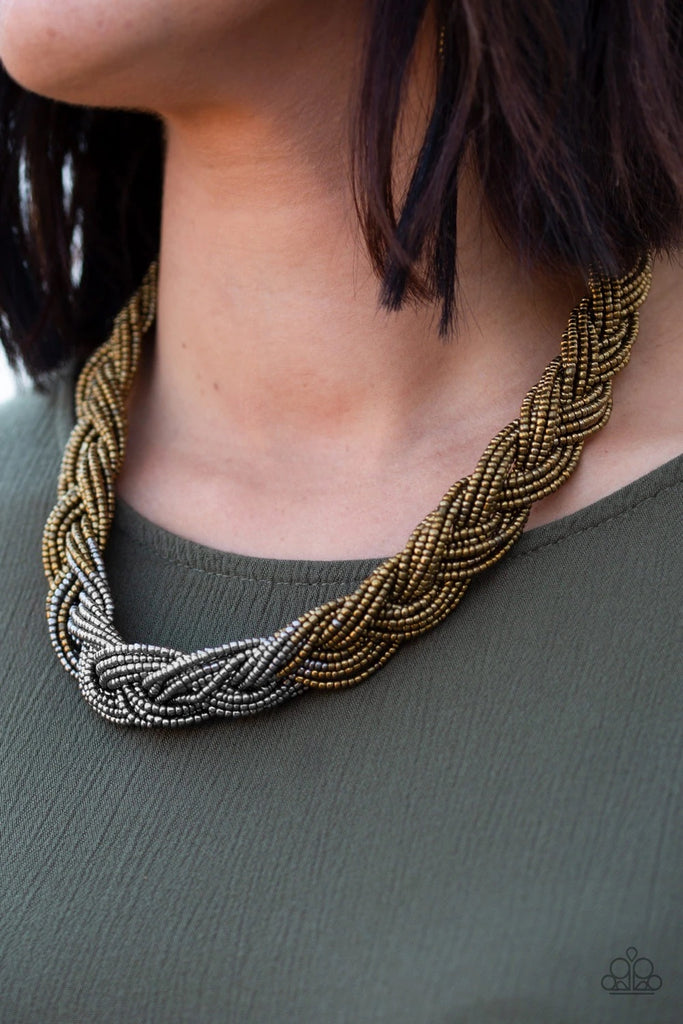 Strands of brass seed beads create an indigenous braid below the collar. The brass seed beads gradually morph into metallic silver beads at the center for a chic contrasting look. Features an adjustable clasp closure.  Sold as one individual necklace. Includes one pair of matching earrings.