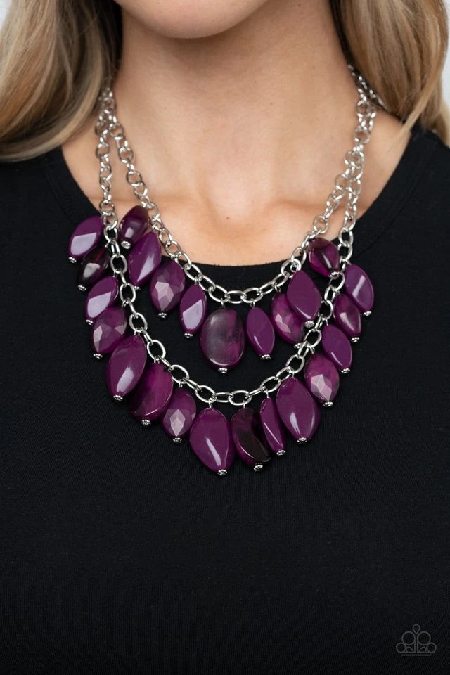 Two boisterous rows of glassy, opaque, and faceted Magenta Purple beads boldly layer below the collar for a vivaciously colorful look. Features an adjustable clasp closure.  Sold as one individual necklace. Includes one pair of matching earrings.  
